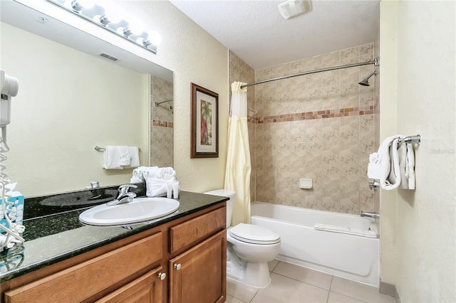 full bathroom featuring vanity, a textured ceiling, shower / bathtub combination with curtain, tile patterned flooring, and toilet