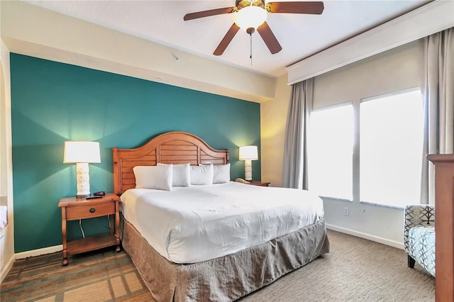 bedroom featuring dark hardwood / wood-style flooring and ceiling fan