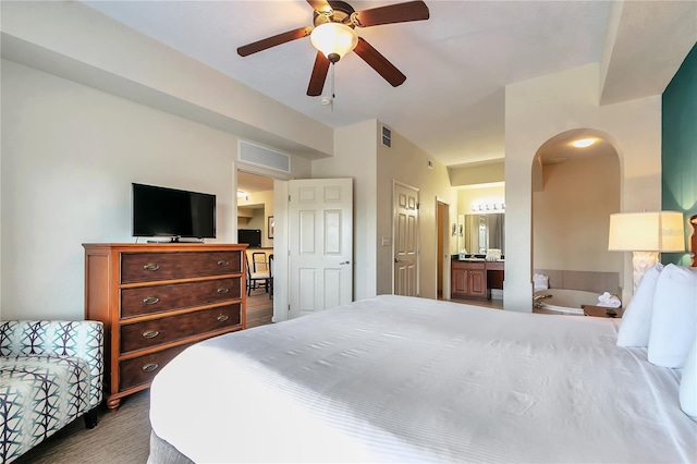 bedroom featuring ensuite bathroom and ceiling fan