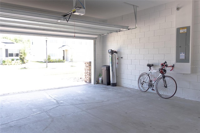 garage featuring electric panel and a garage door opener