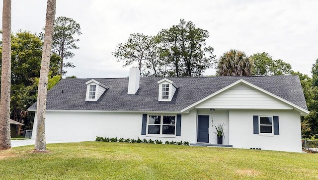 view of front of home with a front lawn