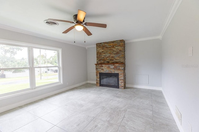 unfurnished living room with ceiling fan, a stone fireplace, and ornamental molding