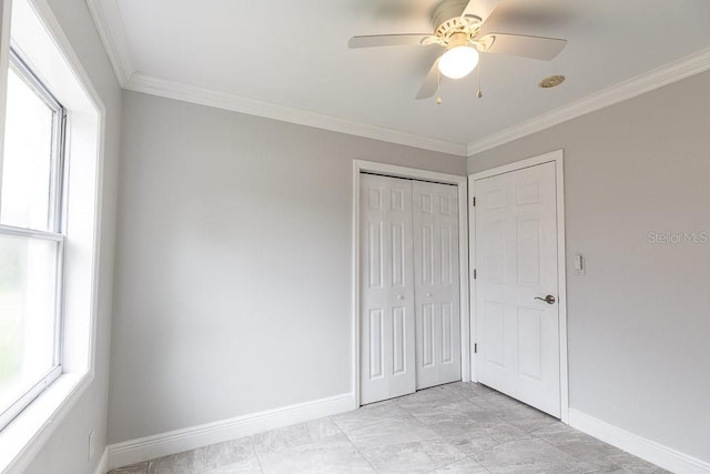 unfurnished bedroom featuring light tile patterned floors, a closet, ceiling fan, and ornamental molding