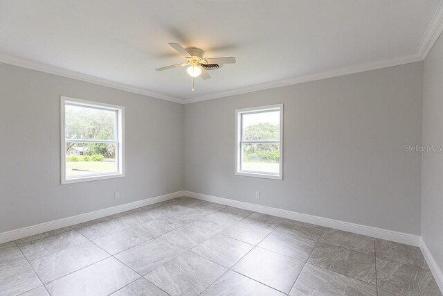 unfurnished room featuring ceiling fan and crown molding