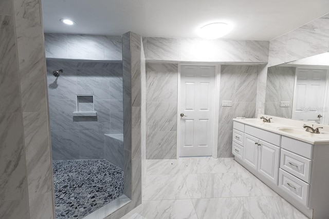 bathroom featuring vanity and tiled shower