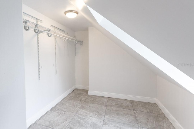 spacious closet with lofted ceiling