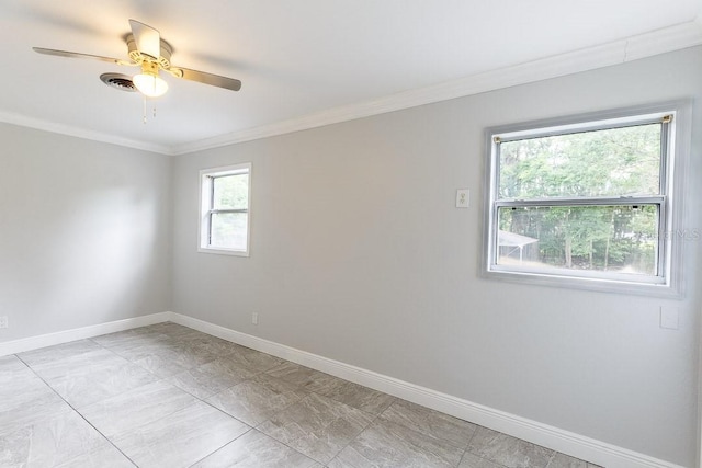 spare room featuring ceiling fan and crown molding