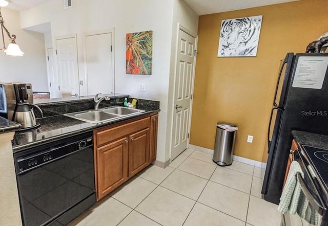 kitchen with a sink, black dishwasher, electric stove, brown cabinets, and decorative light fixtures