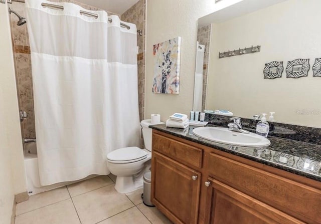 full bathroom with toilet, shower / bath combo, tile patterned flooring, and vanity