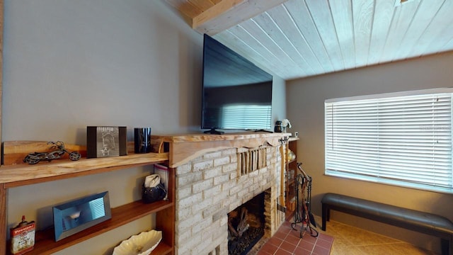 living room with wood ceiling and a brick fireplace