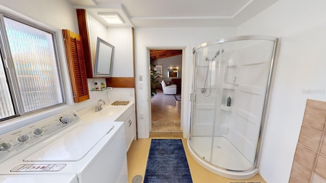 bathroom with tile patterned flooring, vanity, and a shower with shower door