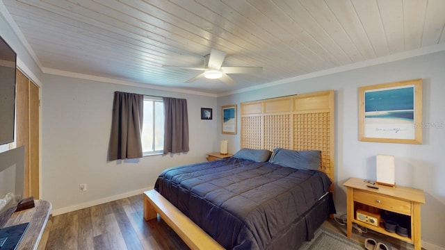 bedroom with dark wood-type flooring, ceiling fan, ornamental molding, and wood ceiling