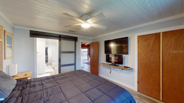 unfurnished bedroom featuring radiator, wood ceiling, ceiling fan, a barn door, and a closet