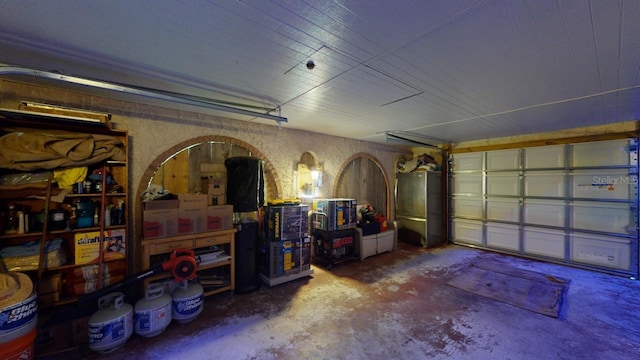 garage featuring stainless steel fridge