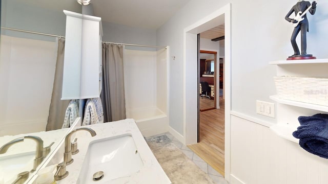 bathroom featuring tile patterned floors, vanity, and shower / bath combo