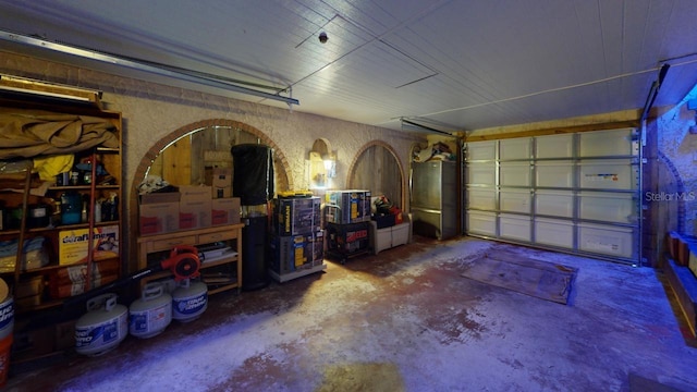 garage featuring stainless steel refrigerator