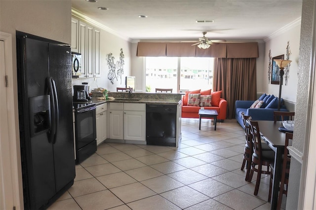 kitchen with white cabinetry, kitchen peninsula, crown molding, light tile patterned floors, and black appliances