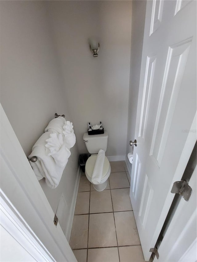 bathroom with tile patterned flooring and toilet