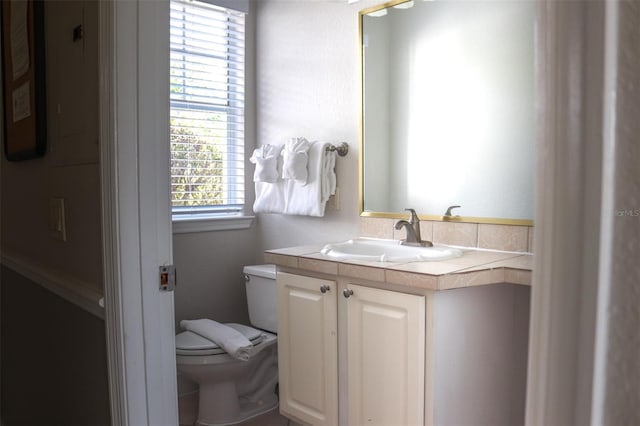 bathroom with vanity and toilet