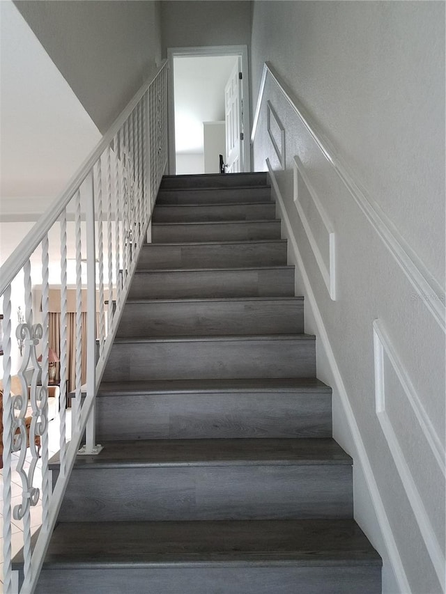 staircase featuring wood-type flooring