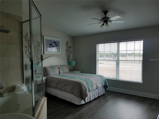 bedroom featuring dark hardwood / wood-style floors, vaulted ceiling, and ceiling fan