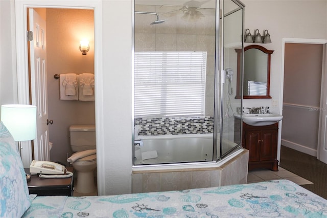 bedroom with light tile patterned floors, ceiling fan, and sink