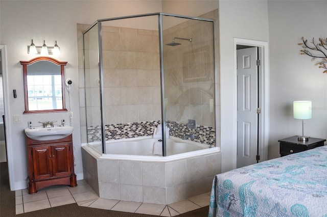 bedroom with light tile patterned floors, a closet, and sink