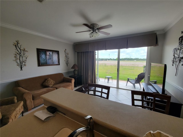 tiled living room with ceiling fan and crown molding