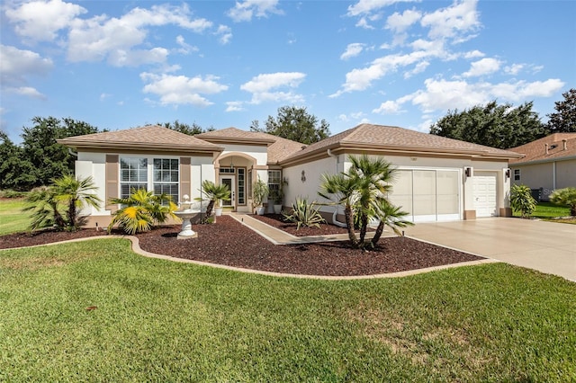 mediterranean / spanish-style house featuring a front yard