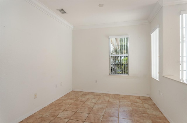 unfurnished room featuring crown molding and light tile patterned flooring