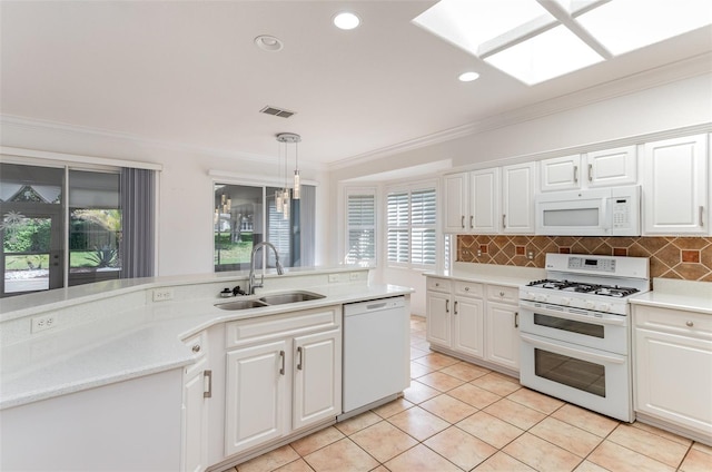 kitchen with white cabinetry, sink, and white appliances