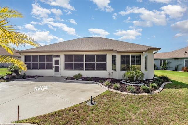 rear view of house with a lawn