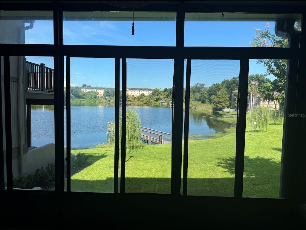 doorway to outside with a water view