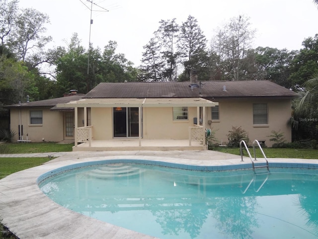 rear view of house featuring a patio area