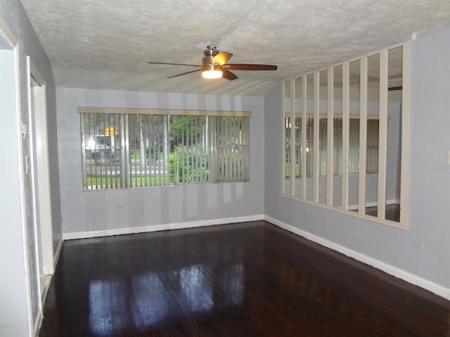 empty room featuring hardwood / wood-style floors, ceiling fan, and a textured ceiling