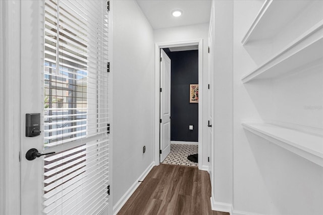 corridor featuring dark wood-type flooring