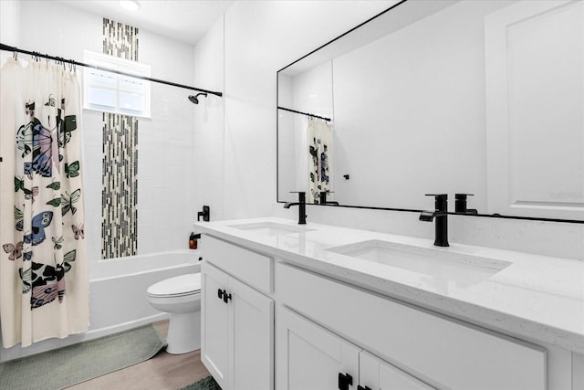 full bathroom with toilet, vanity, and shower / tub combo with curtain