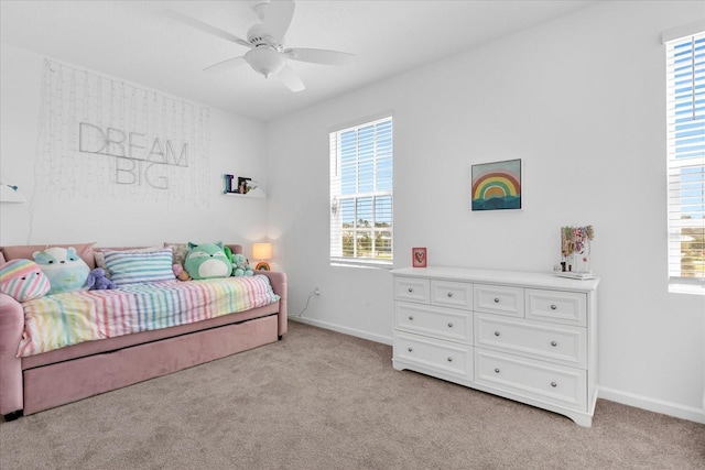 bedroom with light carpet and ceiling fan