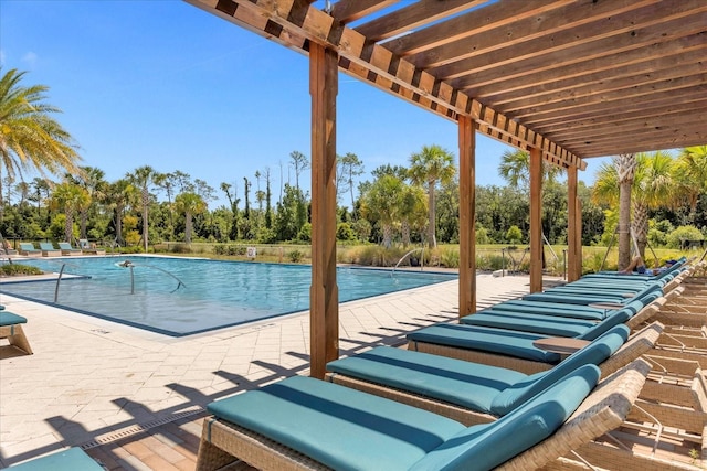 view of swimming pool featuring a pergola and a patio