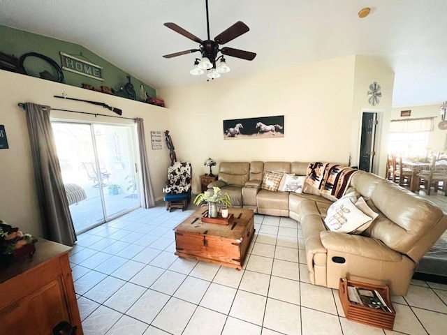 tiled living room featuring ceiling fan and vaulted ceiling