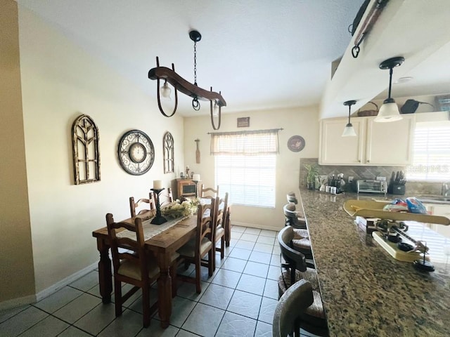 dining area featuring light tile patterned floors and a wealth of natural light