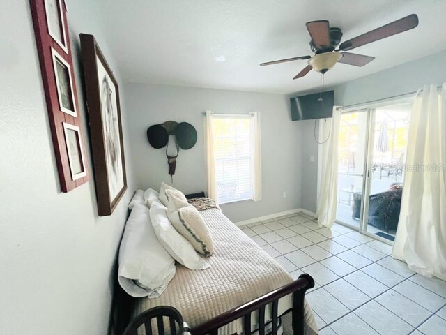 bedroom featuring ceiling fan, access to exterior, and light tile patterned flooring