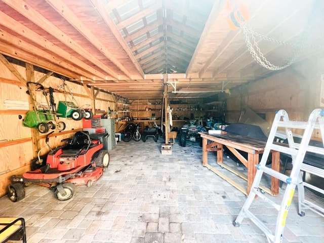 interior space with a workshop area and wood walls