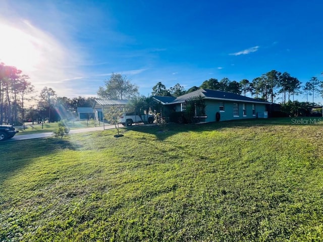 view of property exterior with a lawn