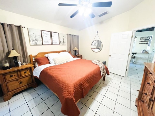 bedroom with light tile patterned flooring, visible vents, and ceiling fan