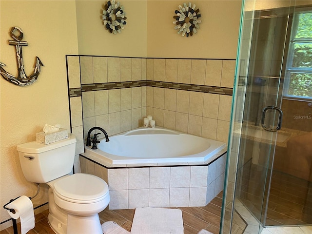 bathroom featuring wood-type flooring, toilet, and independent shower and bath