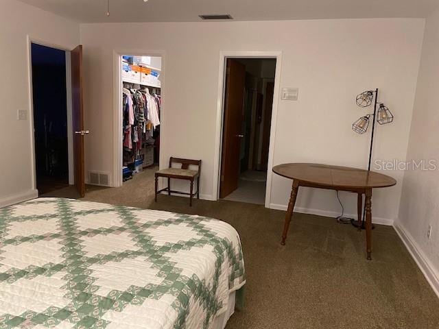 bedroom with carpet flooring and a closet