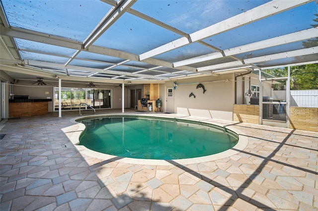 3240 San Mateo St, Clearwater, FL 33759 - view of swimming pool with a ceiling fan, a patio area, and a lanai