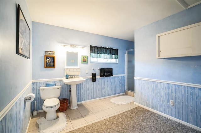 3240 San Mateo St, Clearwater, FL 33759 - bathroom featuring toilet, tile patterned floors, and a stall shower