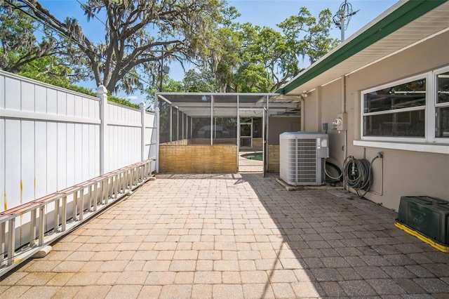 3240 San Mateo St, Clearwater, FL 33759 - view of patio / terrace featuring central AC and glass enclosure